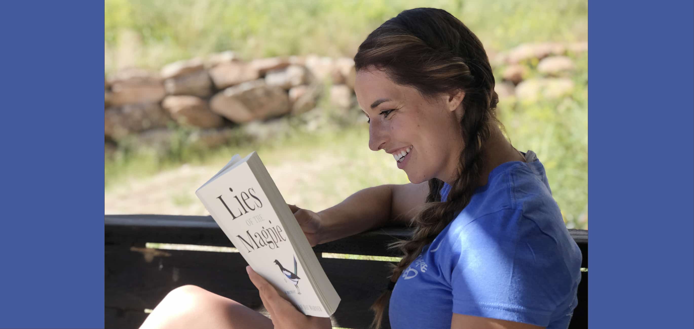 Woman smile reading Lies of the Magpie
