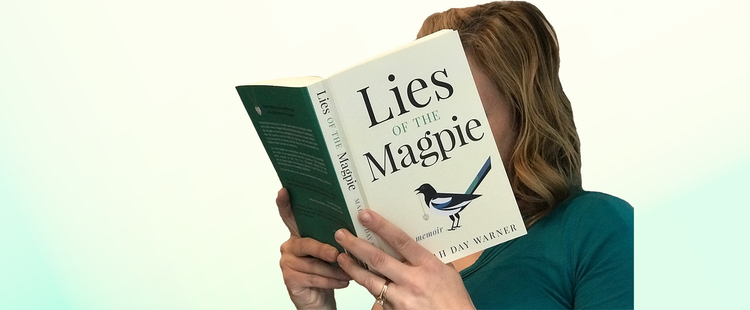 Woman reading Lies of the Magpie